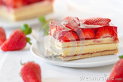 Piece of Strawberry Cake on a white plate Stock Photo