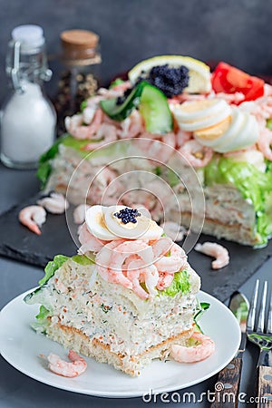 Piece of traditional savory swedish sandwich cake Smorgastorta w Stock Photo