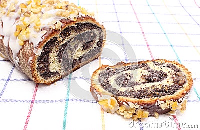 Piece and whole poppy seed cake Stock Photo