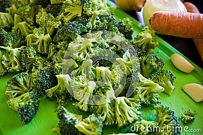 Pieces of broccoli on cutting board Stock Photo