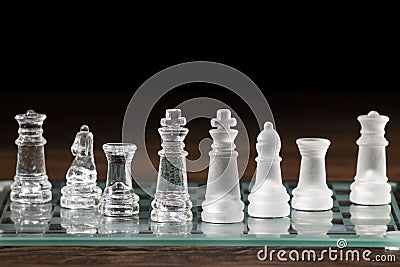 Pieces of chess on a chess board. Rook, knight, bishop, queen and King Stock Photo