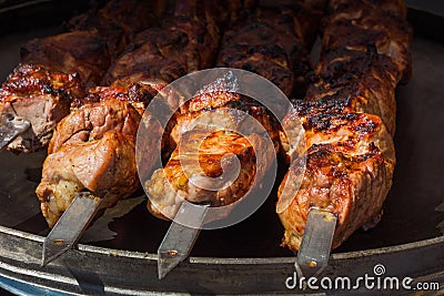 Pieces of cooked lamb over hot coals Stock Photo