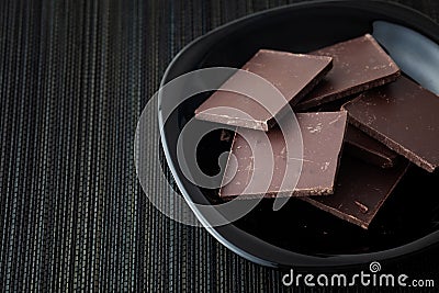 Pieces of dark broken chocolate Stock Photo