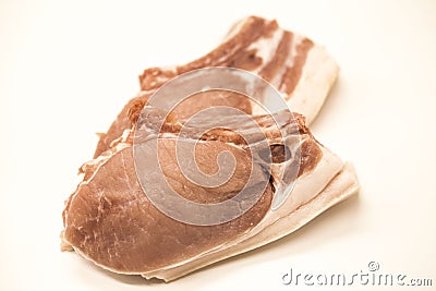 Pieces of fresh raw pork appetizing close-up on a white background. Stock Photo