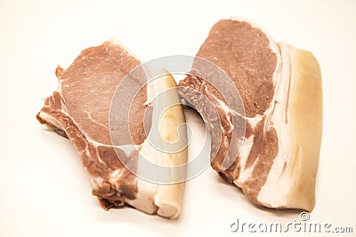 Pieces of fresh raw pork appetizing close-up on a white background. Stock Photo