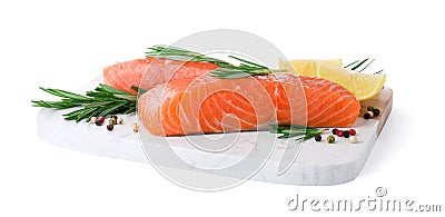 Pieces of fresh raw salmon, spices and lemon slices on white background Stock Photo