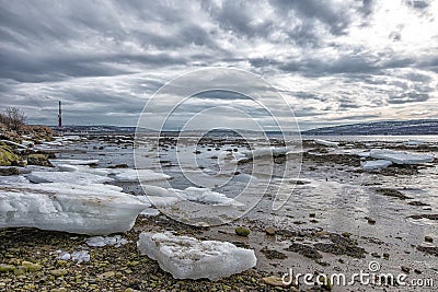 Pieces of freshwater ice at in the water near coast Stock Photo