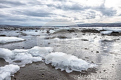 Pieces of freshwater ice at in the water near coast Stock Photo