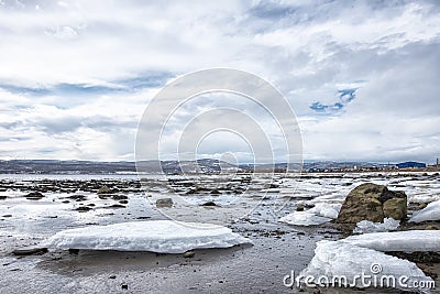 Pieces of freshwater ice at in the water near coast Stock Photo