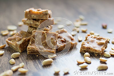 Pieces of peanut caramels on the table Stock Photo