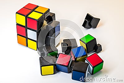 Pieces of Rubik`s Cube for problem solving on white background Editorial Stock Photo