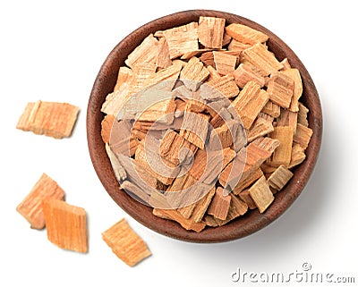 Pieces of sandalwood in the wooden bowl, isolated on white Stock Photo