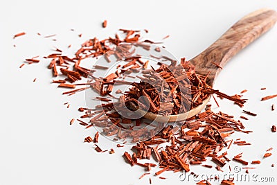 Pieces of sandalwood on a wooden spoon on a white background Stock Photo