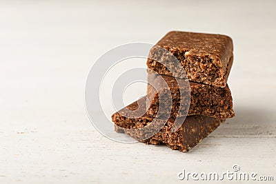 Pieces of tasty protein bar on white table. Stock Photo