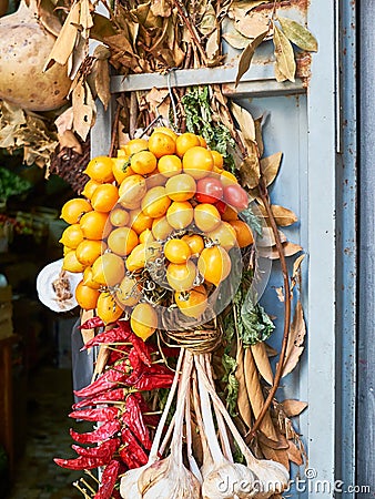 Piennolo tomatoes bunch in a greengrocer stall. Naples, Italy. Stock Photo