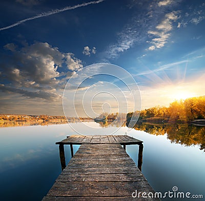 Pier on a calm river Stock Photo