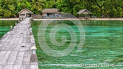 Pier of Dive Station - Kri Island. Clound above Gam in Background. Raja Ampat, Indonesia, West Papua Stock Photo