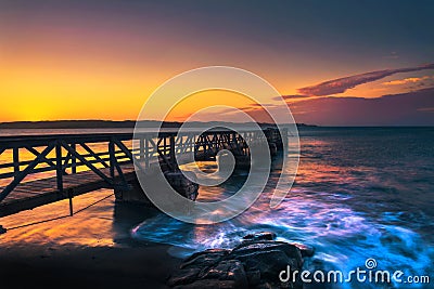 Pier in the harbour town of Luderitz at sunset in southwest Namibia Stock Photo