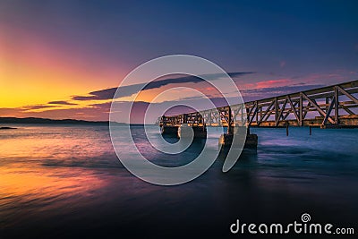 Pier in the harbour town of Luderitz at sunset in southwest Namibia Stock Photo