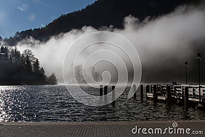 The pier of KÃ¶nigssee in Bavaria, Germany, in morning fog Stock Photo