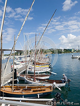 the pier with moored boats and sailing boats Editorial Stock Photo