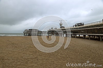 The pier of Scheveningen that enters the North Sea from the beach Editorial Stock Photo