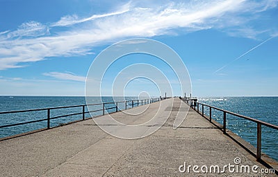 Pier sea beach jetty bridge sea summer the sky blue clouds heat morning nature stay vacation expanse Stock Photo