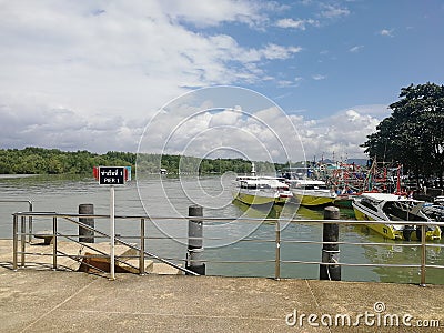 pier with speedboats with title Editorial Stock Photo