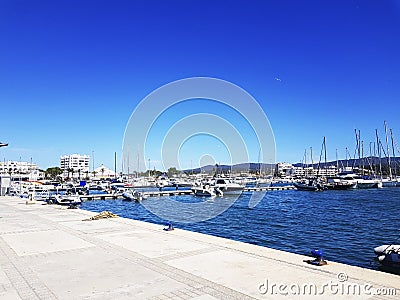 Pier , yachts in the blue sea Editorial Stock Photo