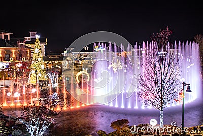 Pigeon Forge, Tennessee - December 3, 2017 : A colorful display from state of the art, multi-tiered show fountain at The Island. Editorial Stock Photo