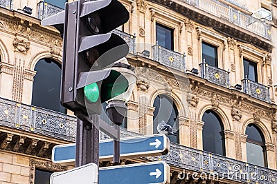 Pigeon on a traffic sign near a carefour Stock Photo