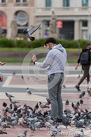 Pigeons in Plaza CataluÃ±a empty without tourists in times of the Covid in 2021 Editorial Stock Photo