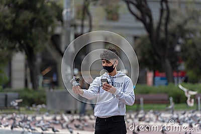 Pigeons in Plaza CataluÃ±a empty without tourists in times of the Covid in 2021 Editorial Stock Photo