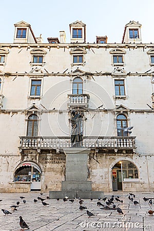 Pigeons and a statue in Split Editorial Stock Photo