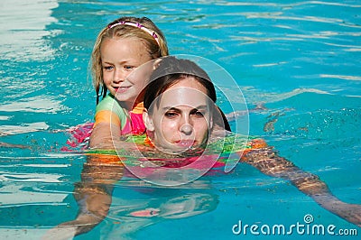 Piggy back swimming Stock Photo