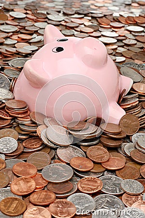 Piggy bank drowning in debt Stock Photo