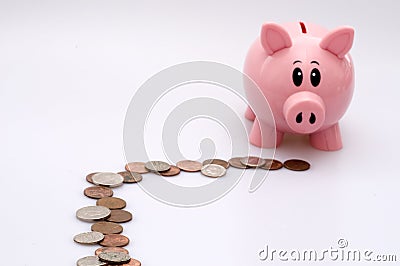 Piggy Bank Following Trail of Coins Stock Photo