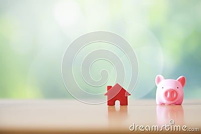 Piggy bank and home Stock Photo