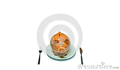 A piggy bank is sitting on the plate middle version Stock Photo