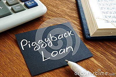 Piggyback loan handwritten sign on the sheet Stock Photo