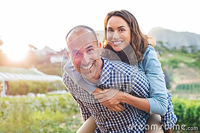 Piggyback mature couple Stock Photo