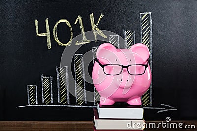 Piggybank In Front Of Blackboard Stock Photo