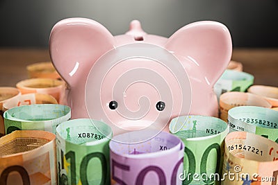 Piggybank Surrounded With Euro Banknotes Stock Photo