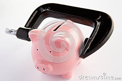 Piggybank in a vice Stock Photo