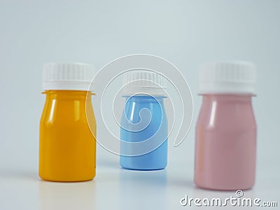 pigment resin paint in the bottle, many colors have pink, blue, and orange Stock Photo