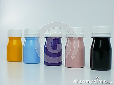 pigment resin paint in the bottle, many colors there are purple, pink, blue, orange, and black Stock Photo