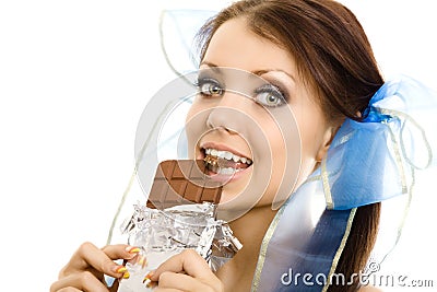 Pigtails girl eat chocolate closeup Stock Photo