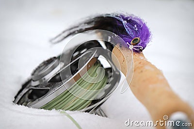 Purple pike fly with fly fishing rod and reel Stock Photo