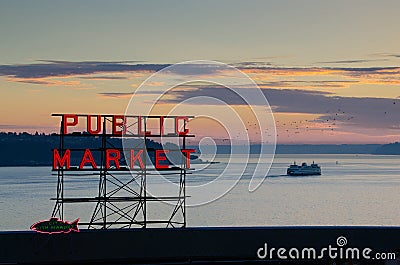 Pike Place Market Sign and Ferry at Sunset in Seattle Editorial Stock Photo