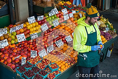 A Pike`s Market Fruit Seller Editorial Stock Photo